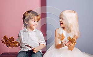 Cute child play with Leaf. Leaf fall leaves isolated. Autumn copy spaceLeaf fall trend and vogue. Autumn leaves