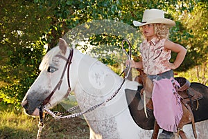 Cute child on a pony.