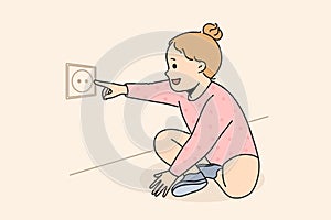 Cute child put finger in electrical socket