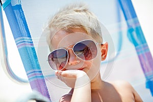 Cute child relaxing on beach