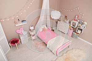 Cute child`s room interior with toys and furniture, above view