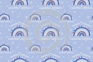 Cute childish seamless pattern of bright abstract rainbows, white doodles hearts, drops and geometric shapes on a gentle blue back