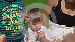 Cute Children Eating Watermelon on the Nature