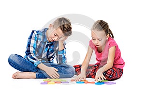 Cute children with large colorful alphabet letters on white background. Kids speech therapy concept. Speech impediment, logopedy. photo