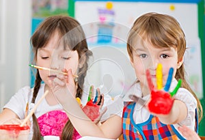 Cute children painting at kindergarten