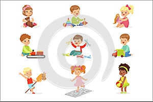 Cute Children Playing With Different Toys And Games Having Fun On Their Own Enjoying Childhood.