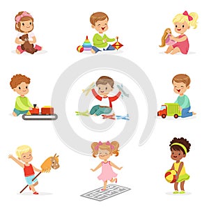 Cute Children Playing With Different Toys And Games Having Fun On Their Own Enjoying Childhood.