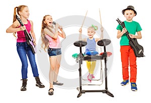 Cute children playing instruments and girl sings