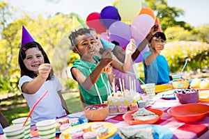 Cute children smiling and having fun during a birthday party