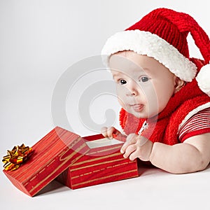Cute christmas baby with gift