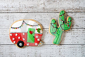 Cute Christmas camper and cactus decorated sugar cookies