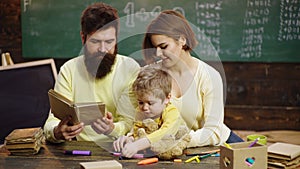 Cute clever boy study. Parents teaching children. Family in early development concept. Father mother and child son