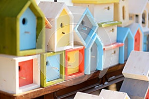 Cute colorful wooden nesting boxes sold on Easter market in Vilnius. Lithuanian capital`s traditional crafts fair is held every