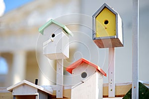 Cute colorful wooden nesting boxes sold on Easter market in Vilnius. Lithuanian capital`s traditional crafts fair is held every