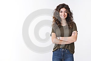 Cute confident successful young female diatologist with curly hair cross arms chest self-assured ready give helpful photo
