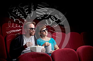 Cute couple in cinema watching movie