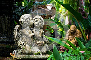 Cute couple cupid Statue in the garden