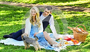 cute couple on date on blanket. camping concept. happy couple in love. woman and man lying in park and enjoying day