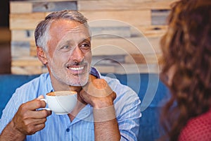 Cute couple having coffee together