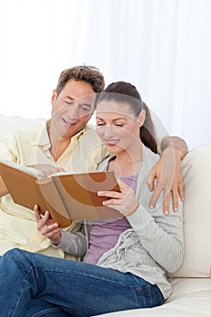 Cute couple looking at a photo album