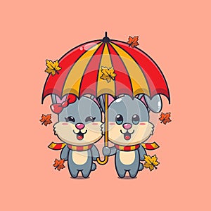 Cute couple rabbit with umbrella at autumn season.