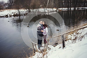 Cute couple standing in a winter park