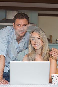 Cute couple using laptop together