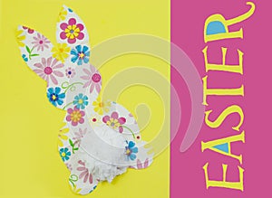 Cute, craft cut-out Easter bunny shape made out of cheerful patterned and colorful paper napkins and a tissue paper tail on a