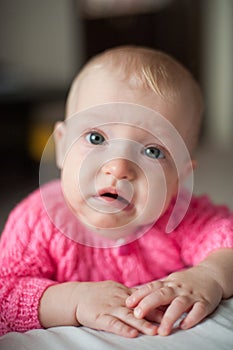 Cute crying baby, upset teething girl. Sad child look at the camera