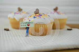 Cute cupcakes with love heart decorations and mothers day words