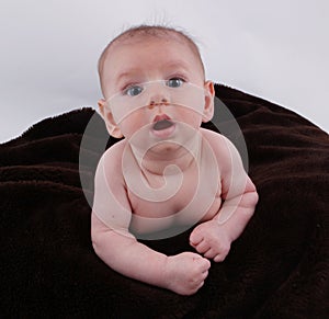 Cute Curious baby learning to crawl