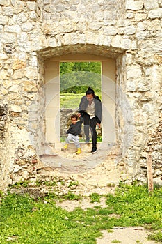 Cute curious boy with mom on old town Dreznik