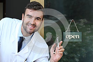 Cute dentist holding metallic tool