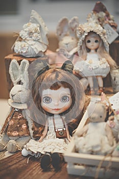 Cute dolls on display at doll shop. Soft focus on the blythe doll attached with property release. Vintage filter and slightly