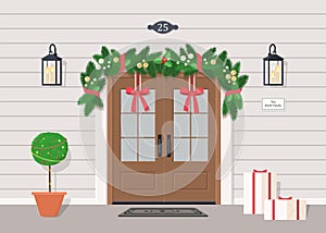 Cute double front door with Christmas decoration, garland, street lanterns, gifts and plant