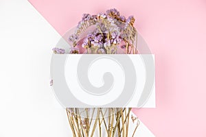 Cute dried violet statice flower with white card on top