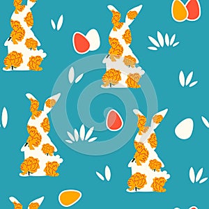 Cute easter seamless vector pattern illustration with colorful egg and rabbits with flowers on blue background