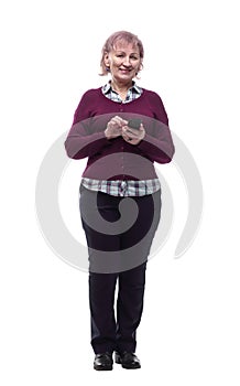 Cute elderly woman reading a message on her smartphone . isolated on a white