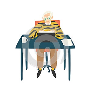 Cute elderly writer, critic or novelist siting at desk, smoking pipe and working on typewriter. Author writing book