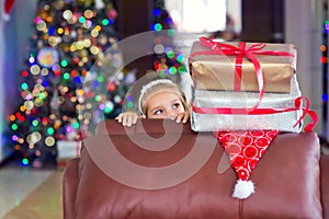 Cute elegant girl celebrate Christmas and New Year with presents