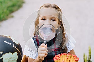 Cute Elementary Schoolgirl Smile Through Magnifier