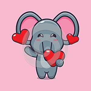 Cute elephant cartoon character holding love heart at valentine\'s day.
