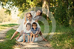 Cute family of four in the park