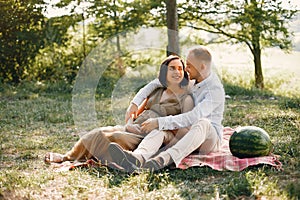 Cute family spending time in a summer field