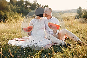 Cute family spending time in a summer field