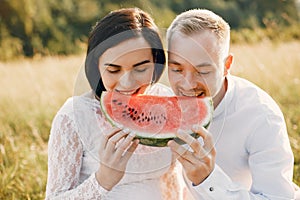 Cute family spending time in a summer field