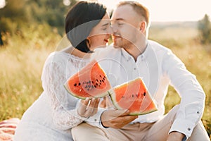 Cute family spending time in a summer field