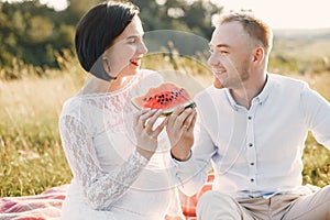 Cute family spending time in a summer field