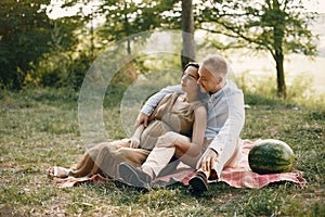 Cute family spending time in a summer field