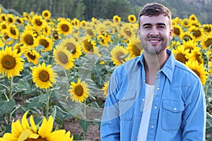 Cute farmer in sunflower field